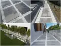 Nowoczesna opaska wokół domu z płyt betonowych i białego żwiru tworzy eleganckie ścieżki i ozdobne rabaty.